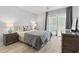 Cozy bedroom features balcony access, neutral decor, and matching bedside tables at 206 Maison Dr. # Q-204, Myrtle Beach, SC 29572