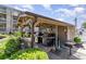 Outdoor grilling area with multiple grills, storage and counterspace for barbecuing near the pool at 206 Maison Dr. # Q-204, Myrtle Beach, SC 29572