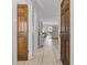 View of a light-filled condo hallway leading into the living room with hardwood flooring at 206 Maison Dr. # Q-204, Myrtle Beach, SC 29572