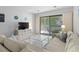 Bright living room with access to balcony and neutral tones, perfect for relaxing at 206 Maison Dr. # Q-204, Myrtle Beach, SC 29572