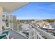 Balcony with marina view featuring railing, white chairs, and blue cushions for tranquil enjoyment at 2100 Sea Mountain Hwy. # 224, North Myrtle Beach, SC 29582