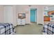 Bedroom featuring two beds with blue patterned comforters and a flat screen tv at 2100 Sea Mountain Hwy. # 224, North Myrtle Beach, SC 29582