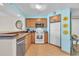 Condo kitchen featuring wood cabinets, stainless dishwasher, and modern appliances at 2100 Sea Mountain Hwy. # 224, North Myrtle Beach, SC 29582