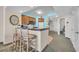 Kitchen with breakfast bar, wood cabinets, modern appliances, and a view to the bedroom at 2100 Sea Mountain Hwy. # 224, North Myrtle Beach, SC 29582