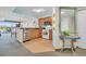 Bright kitchen featuring wood cabinets, tile flooring, stainless steel dishwasher, and breakfast bar at 2100 Sea Mountain Hwy. # 224, North Myrtle Beach, SC 29582