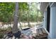 Backyard deck with two chairs, table, and stone pathway at 2128 Adams Circle, Little River, SC 29566