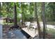 Backyard deck with two chairs and table at 2128 Adams Circle, Little River, SC 29566