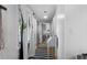 Bright hallway featuring hardwood floors, white walls, and natural light from a nearby window at 2128 Adams Circle, Little River, SC 29566