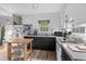 Bright kitchen area with white cabinets, a double sink, and a view of the backyard at 2128 Adams Circle, Little River, SC 29566