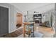 Open layout reveals seamless flow from the kitchen to the comfortable living room with a fireplace at 2128 Adams Circle, Little River, SC 29566