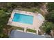 Aerial view of the community pool featuring tables and lounge chairs at 2128 Adams Circle, Little River, SC 29566
