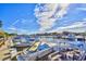 Scenic marina view of several boats docked with bright blue sky and fluffy clouds at 2151 Bridge View Ct. # 2302, North Myrtle Beach, SC 29582