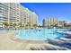 Exterior community pool with large sun deck and high-rise buildings in the background at 2151 Bridge View Ct. # 2302, North Myrtle Beach, SC 29582