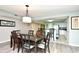 Bright dining area with modern table and seating, open to a clean, white kitchen at 2151 Bridge View Ct. # 2302, North Myrtle Beach, SC 29582