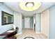 Welcoming condo entrance with a console table, mirror, tiled floors, and soft blue walls at 2151 Bridge View Ct. # 2302, North Myrtle Beach, SC 29582