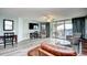 Bright living area with stylish furniture, a large flat-screen TV, and a tranquil balcony view at 2151 Bridge View Ct. # 2302, North Myrtle Beach, SC 29582