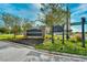 A sign reads 'Yacht Club Villas', set amidst professionally landscaped grounds at 2151 Bridge View Ct. # 2302, North Myrtle Beach, SC 29582