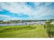Scenic waterfront view showcasing manicured lawn with lush green grass and abundant boats at 2151 Bridge View Ct. # 2302, North Myrtle Beach, SC 29582