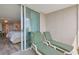 Outdoor patio with two lounge chairs and a view into the bedroom at 2151 Bridgeview Ct. # 3-405, North Myrtle Beach, SC 29582