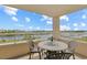 Relaxing balcony with outdoor dining furniture, perfect for enjoying the waterfront view at 2151 Bridgeview Ct. # 3-405, North Myrtle Beach, SC 29582