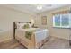 Cozy bedroom featuring a comfortable bed and a window with blinds at 2151 Bridgeview Ct. # 3-405, North Myrtle Beach, SC 29582