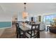 Inviting dining area with stylish decor, seamlessly flowing into the living room and kitchen at 2151 Bridgeview Ct. # 3-405, North Myrtle Beach, SC 29582