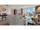 Comfortable living room boasts a sliding glass door to the balcony, and cozy decor at 2151 Bridgeview Ct. # 3-405, North Myrtle Beach, SC 29582