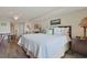 Bedroom featuring a king-sized bed, ceiling fan, and an adjacent sitting area at 2151 Bridgeview Ct. # 3-405, North Myrtle Beach, SC 29582