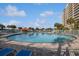 Large outdoor pool area with lounge chairs, poolside bar, and sunny skies at 2151 Bridgeview Ct. # 3-405, North Myrtle Beach, SC 29582