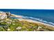 Aerial view of the property near the beach, highlighting lush greenery and coastal beauty at 217 Myrtle Ln., Myrtle Beach, SC 29572