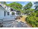 Spacious backyard with a screened-in porch, deck, and a glimpse of the inviting pool area at 217 Myrtle Ln., Myrtle Beach, SC 29572