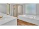 Modern bathroom with a soaking tub, separate shower, and sleek fixtures at 217 Myrtle Ln., Myrtle Beach, SC 29572