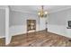 Formal dining room featuring chair rail and a chandelier, adjacent to a workout space at 217 Myrtle Ln., Myrtle Beach, SC 29572