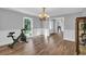 Open dining area with hardwood floors, chair rail, and chandelier, bathed in natural light at 217 Myrtle Ln., Myrtle Beach, SC 29572