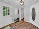 Inviting entryway featuring stylish doors, shoe rack, and hardwood floors, creating a welcoming ambiance at 217 Myrtle Ln., Myrtle Beach, SC 29572
