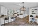 Spacious kitchen featuring granite countertops, island seating, and bright lighting for a functional space at 217 Myrtle Ln., Myrtle Beach, SC 29572