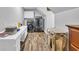 Bright laundry room with wooden floors, modern washer and dryer, and a built-in folding station for added convenience at 217 Myrtle Ln., Myrtle Beach, SC 29572