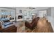 Inviting living room with fireplace, hardwood floors, and ample natural light at 217 Myrtle Ln., Myrtle Beach, SC 29572