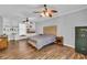 Spacious bedroom with built-in shelving, wood floors, and neutral decor at 217 Myrtle Ln., Myrtle Beach, SC 29572