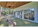 Enclosed sun room with screened walls, ample light, and a ceiling fan that creates a comfortable, airy retreat at 217 Myrtle Ln., Myrtle Beach, SC 29572
