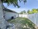 Fenced backyard offering privacy, featuring a well-maintained lawn and the home's exterior siding at 2217 Belladora Rd., Conway, SC 29527