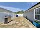 Spacious backyard with a grill, white fencing, and pavers, offering a private and functional outdoor space at 2217 Belladora Rd., Conway, SC 29527