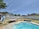 Inviting backyard featuring a pool, hammock, and stylish outdoor furniture, ideal for summer gatherings at 2217 Belladora Rd., Conway, SC 29527