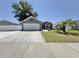 Charming single-story home with well-manicured lawn, gray siding, and a paved driveway at 2217 Belladora Rd., Conway, SC 29527