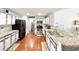 Well-lit kitchen with granite countertops, stainless steel appliances, and modern cabinetry at 2217 Belladora Rd., Conway, SC 29527