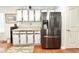 Kitchen with updated cabinets, granite countertops, and a stainless steel refrigerator at 2217 Belladora Rd., Conway, SC 29527