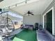 Comfortable covered patio space with stylish seating, a ceiling fan, and an outdoor grill for entertaining at 2217 Belladora Rd., Conway, SC 29527