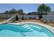 Inviting outdoor pool area with a slide, lounge chairs, and a well-maintained wooden deck for relaxation at 2217 Belladora Rd., Conway, SC 29527