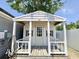 Charming shed featuring decorative seahorse accents and a quaint porch with railing, adding character to the property at 2217 Belladora Rd., Conway, SC 29527