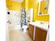 Bright bathroom featuring a tub, shower, floral shower curtain, and vanity at 224 Castle Dr. # 1408, Myrtle Beach, SC 29579